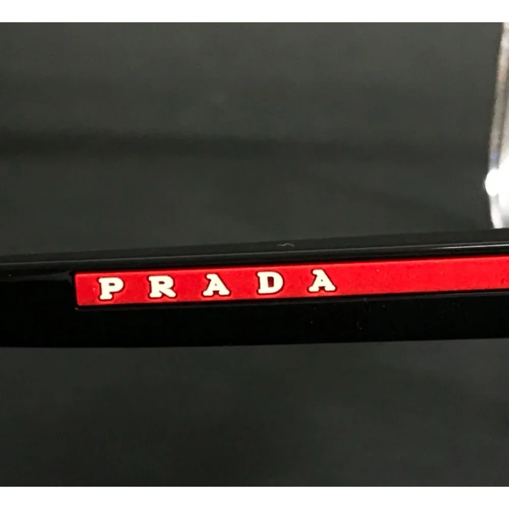 Prada Linea Rossa Eyeglasses Frames VPS06P 2AZ-1O1 Crystal Clear Black 57-18-145